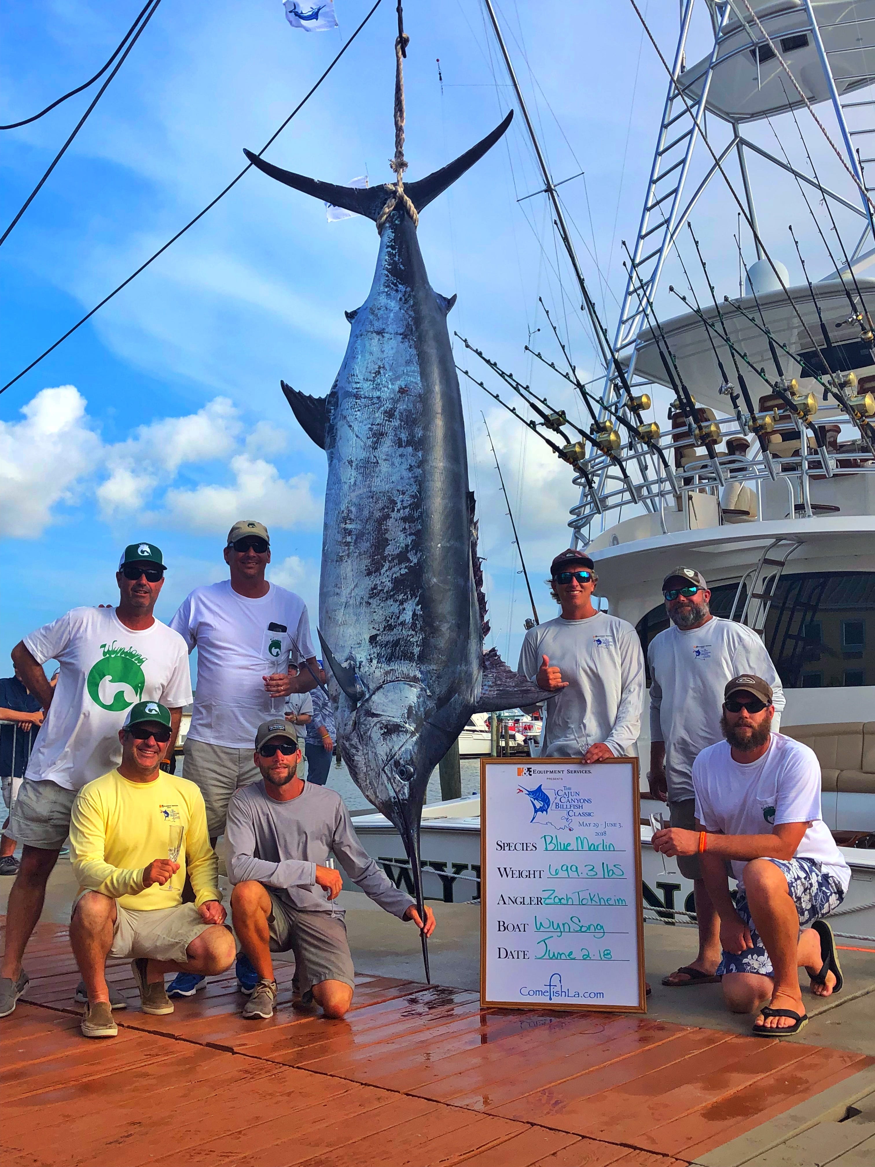 Capt. Allen Staples and Capt. Caleb Brown aboard the Wynsong, along with anglers Zach Tokheim, Ham Poyner, Pickett Reese, Chris Sheppard and Will Wilson, took first place in the Cajun Canyons Billfish Classic in Louisiana with this 669.3-pound blue marlin. Tokheim, standing just to the right of the fish, was the angler on the rod. [CONTRIBUTED PHOTO]